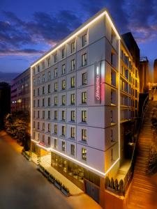 a rendering of a hotel building at night at Hampton By Hilton Istanbul Sisli in Istanbul