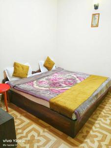 a bed sitting in a room with at SnowCap Regency in Gangtok