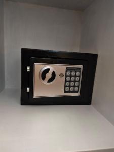 a small black and silver microwave on a wall at Oude haven Borculo in Borkulo
