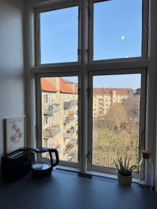 a window in a room with a view of a building at Stunning 6-Pax Valby in Copenhagen