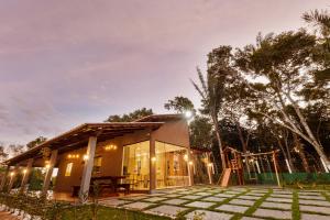 a small house with a playground in front of it at Vila Topo do Mundo in Guaraciaba do Norte