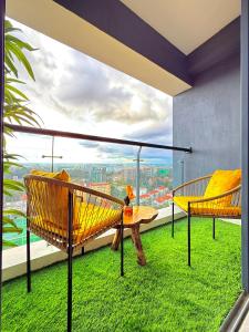 a room with a balcony with a view of the city at Royal essence apartment with swimming pool ,ample parking ,fully equipped gym, child playground and amazing scenic city view in lavington in Nairobi