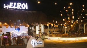 a party with lights and a table and a tree at Manawari Beach Resort in Caliclic