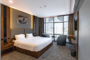 Postel nebo postele na pokoji v ubytování Gardenia Park Alzahraa + 34 fotografií