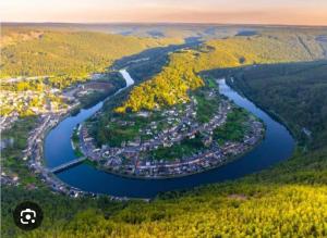 an aerial view of a town next to a river at L'étoile de rocroy in Rocroi