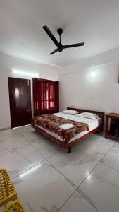 Postel nebo postele na pokoji v ubytování Hotel Paradise Kovalam