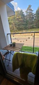 a balcony with a table and a view of a street at Valena 1 - Divčibare Free private Parking in Divčibare