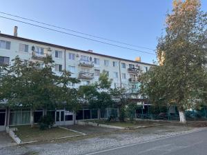 an apartment building on the side of a street at Ruslan Hootel 3 in Poti