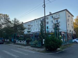 a large white building on the side of a street at Ruslan Hootel 3 in Poti