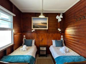 Postel nebo postele na pokoji v ubytování Traka Cottages