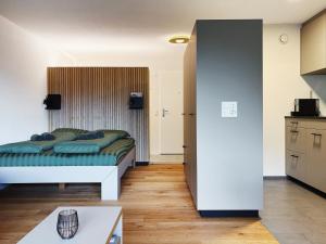 a living room with a bed and a kitchen at Valere C 244 in Leukerbad