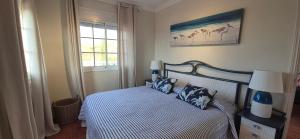 a bedroom with a bed with two pillows on it at puerto de la cruz playa jardin in Puerto de la Cruz