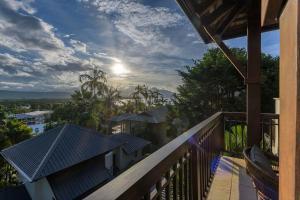 una vista desde el balcón de una casa en Far Pavilions Villa A, Luxe 2-BR Hillside Escape, en Port Douglas