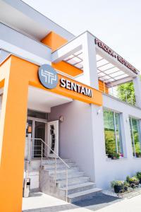 a building with a sign that reads selenium at Sentami in Žilina
