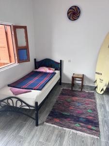 Postel nebo postele na pokoji v ubytování Ocean Jam Surf House