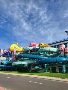 a water park with a bunch of water slides at Apartament Bel Mare F 604 in Międzyzdroje
