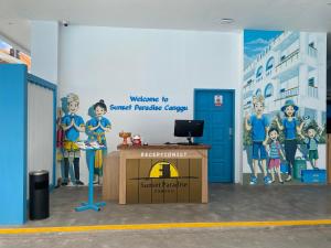 a room with a wall with a mural and a desk at Sunset Paradise Canggu in Canggu +28 photos