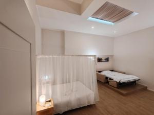 Postel nebo postele na pokoji v ubytování Charme & Chic Nazionale