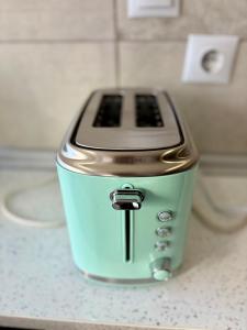 a toaster sitting on top of a counter at StaySanto in Loures in Loures +26 photos