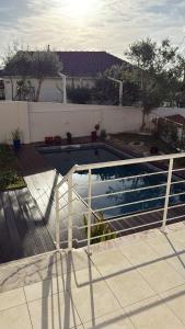 a swimming pool with a fence around it at Solar da Sobreda in Sobreda