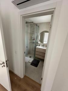a bathroom with a shower and a sink at Solar da Sobreda in Sobreda +10 photos
