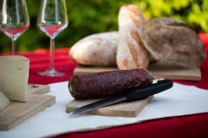 a table with a knife and bread and wine glasses at Il Tiglioré in Poderi Rancoli