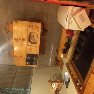 an overhead view of a kitchen with a wooden door at Cabana com Hydro, Recanto das Trutas, SC in Bocaina do Sul +37 photos