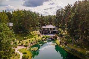 an aerial view of a house in the middle of a river at Villa Valery - pajūrio dvasia dvelkianti oazė in Kupriai