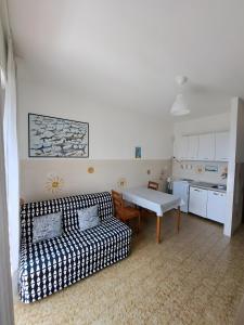 a living room with a couch and a table at Uscio Natura in Uscio