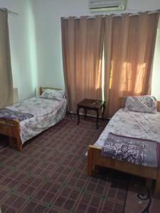 Ένα ή περισσότερα κρεβάτια σε δωμάτιο στο Al Martini Building Number 11