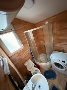 Koupelna v ubytování Gintas Comfort + 21 fotografií