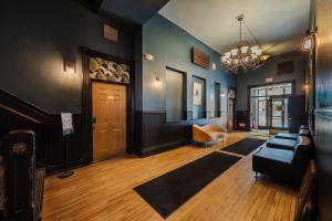 a living room with a couch and a door at Swedetown European Style Hostel by Heirloom Boutique Collection in Duluth +9 photos
