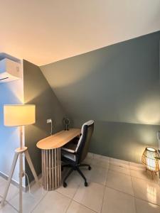 an office with a desk and a chair and a lamp at Villa Montepaone in Montepaone Lido +26 photos