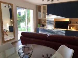 a living room with a couch and a table at Maison d'hôtes à Castres-Saïx in Saix +1 photo