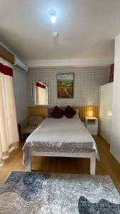a bedroom with a large bed in a room at Honey's Staycation in Davao City