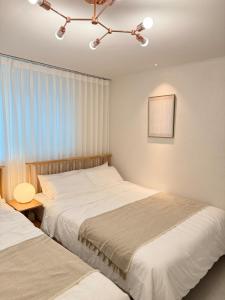 Fotografie z fotogalerie ubytování RYM STAY, New Apartment, Cozy 2BR, 3 beds, 5 min to Subway, near Lotte Tower, Lotte World, KSPO Dome, & COEX v Soulu