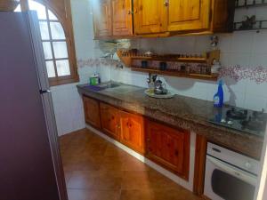 Kuchyň nebo kuchyňský kout v ubytování appartement à al tilal