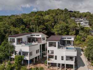 an aerial view of a house with trees at New Luxury 4BR Villa with Seaview in Haad Chao Phao
