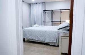 a bedroom with a bed with a metal frame at Villa del Nique in Pembroke +56 photos