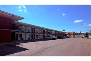 an empty parking lot in front of a building at Hotel O Star Motel Hattiesburg HWY 49 in Hattiesburg