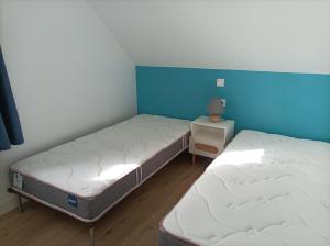 Postel nebo postele na pokoji v ubytování La Cormorane