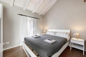 Ένα ή περισσότερα κρεβάτια σε δωμάτιο στο Domas Home appartamento n 3