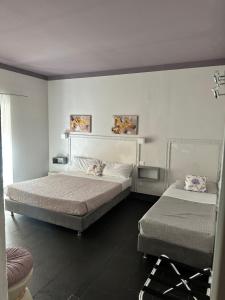 Ένα ή περισσότερα κρεβάτια σε δωμάτιο στο Holidays Rooms Rattazzi