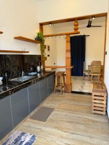 a kitchen with a sink and a counter top at Beach heaven villa in Matara