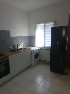 Kuchyň nebo kuchyňský kout v ubytování Charmante maison