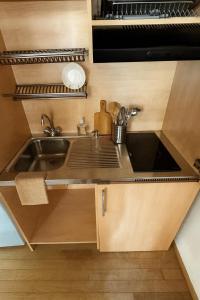 a small kitchen with a sink and a stove at appartamento Ferraresi in San Felice sul Panaro +4 photos