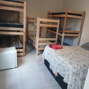 En eller flere senge i et værelse på Pousada da Benção