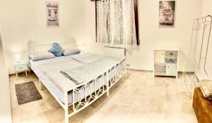 a bedroom with a white bed in a room at Casa sul fiume in Gorgo +63 photos