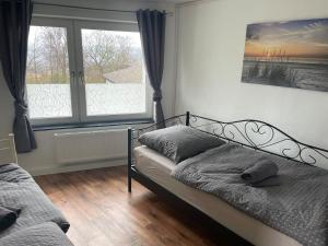Ένα ή περισσότερα κρεβάτια σε δωμάτιο στο Ferienhaus Weserbergland
