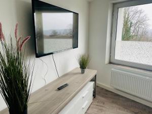 Μια τηλεόραση ή/και κέντρο ψυχαγωγίας στο Ferienhaus Weserbergland